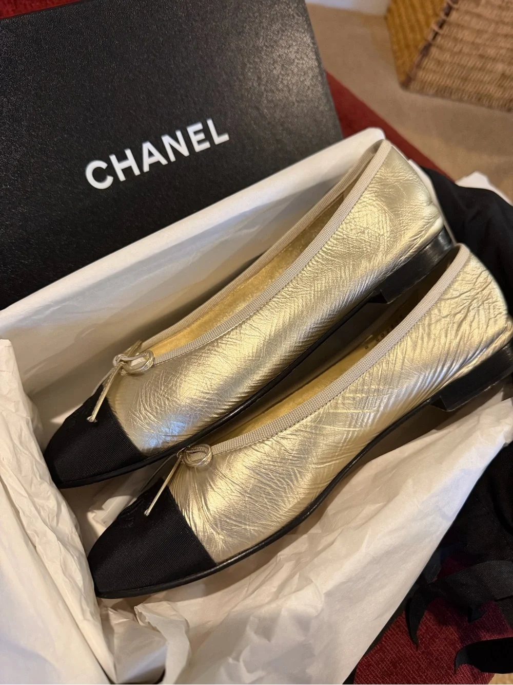 CHANEL Gold Leather Ballet Flats with Black Cap Toe Winter 2025 Season